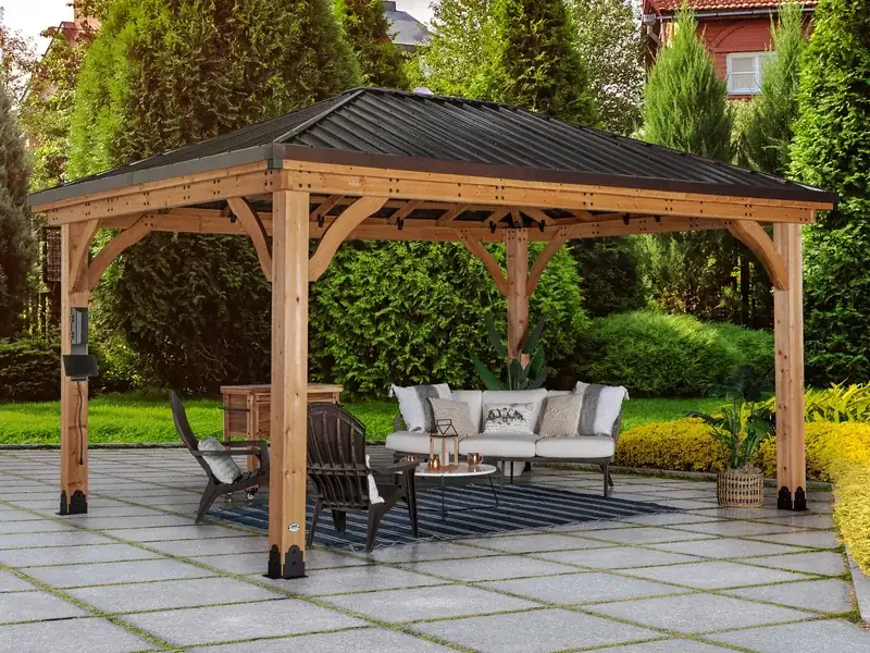 Backyard Discovery Barrington 16×12 hardtop gazebo with cedar posts and a steel hip roof.