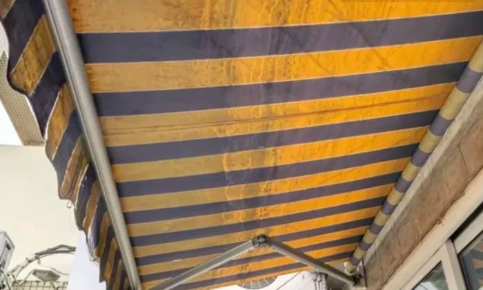 Torn fabric on a retractable awning