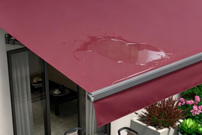 Water pooling on the fabric of a retractable awning